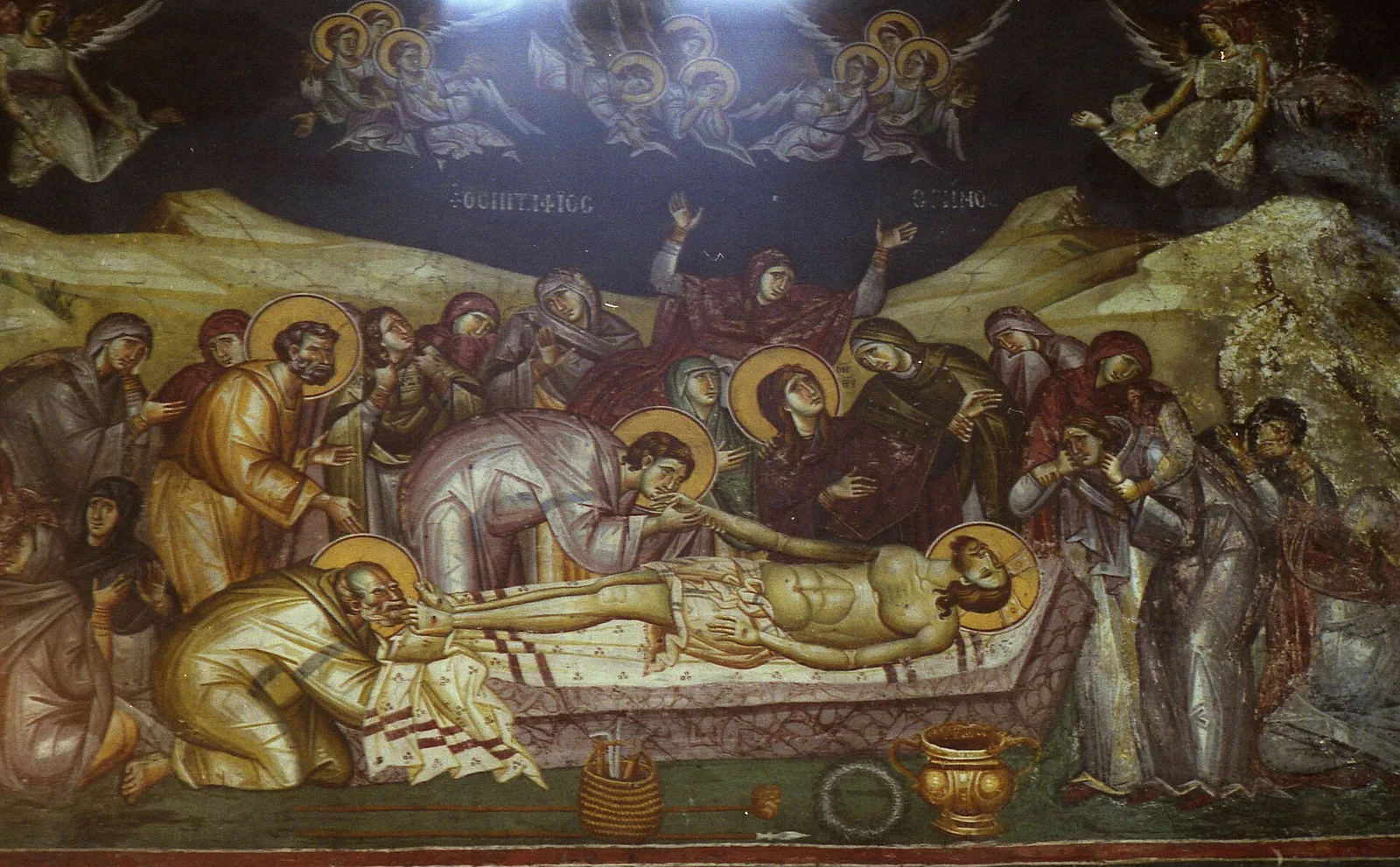 Fresco of the Lamentation: the Virgin and mourners grieve over the body of Christ while angels weep above